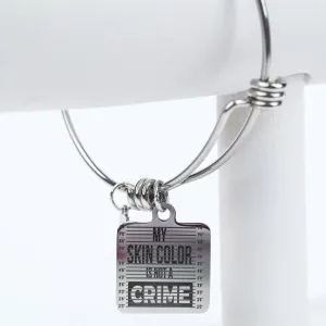 ME™ Word. My Skin Color Is Not a Crime Bangle - Silver