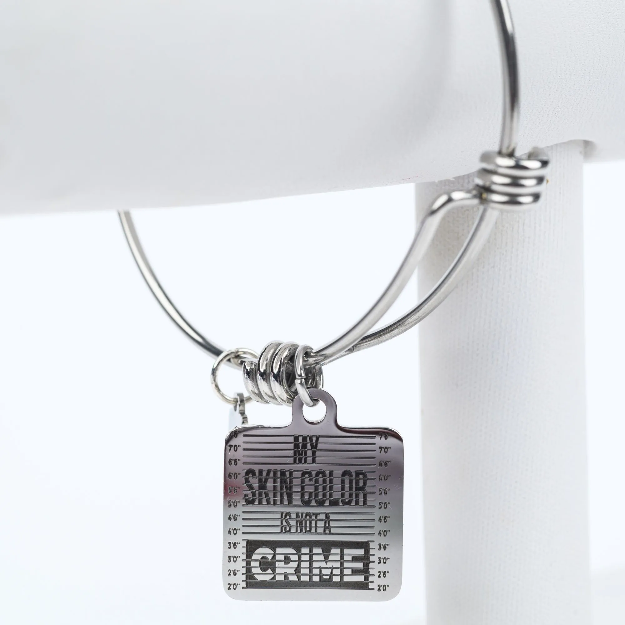 ME™ Word. My Skin Color Is Not a Crime Bangle - Silver